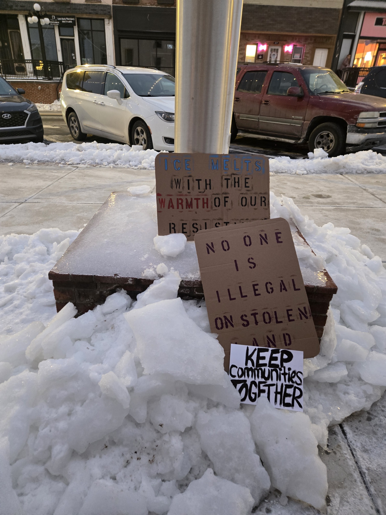 Some of the signs that were brought to the vigil on January 31.