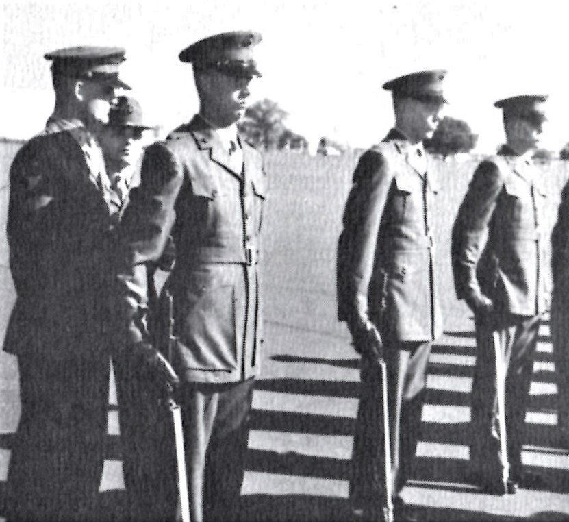 Members of Platoon 195, nearing graduation, pose for a yearbook photo. The author is second in the front rank.