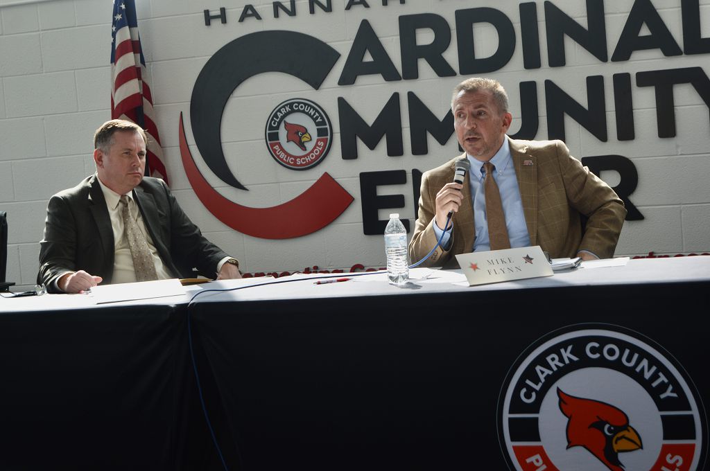 Magistrate Chris Davis listens intently as his opponent for re-election, Winchester City Manager Mike Flynn, answers a question during the Clark County Republicans debate Saturday at the Hannah McClure Cardinal Community Center.