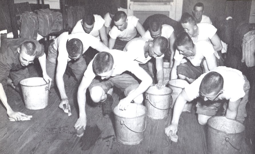 Marine training. Scrubbing the floors of the barracks is a typical job assigned to new recruits.