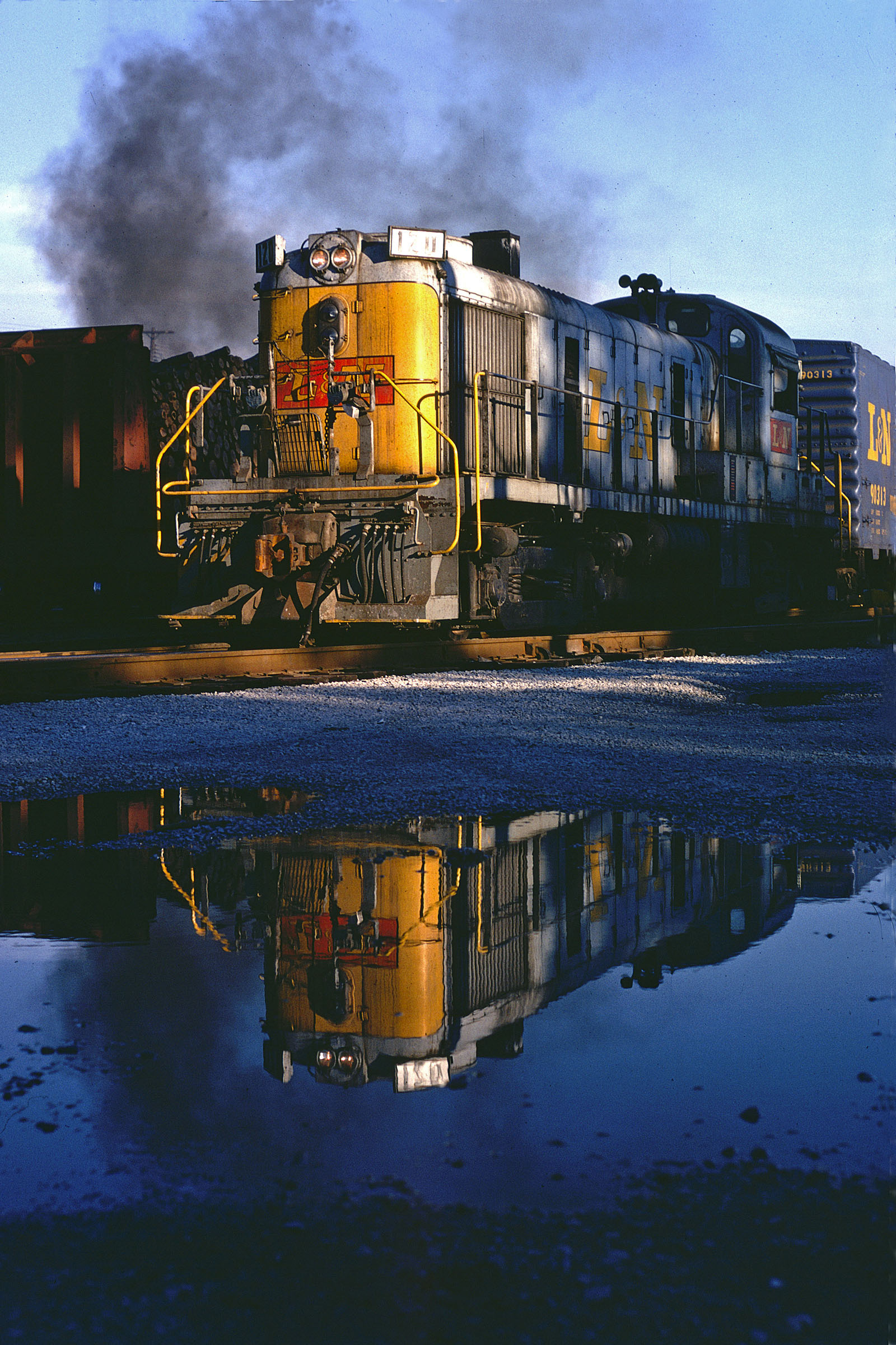 After a 1974 thunderstorm, No. 120 idles at the Patio yard. The diesel engine was an Alco RS3, one of the most common in L&N’s system. (Photo by Garland McKee)