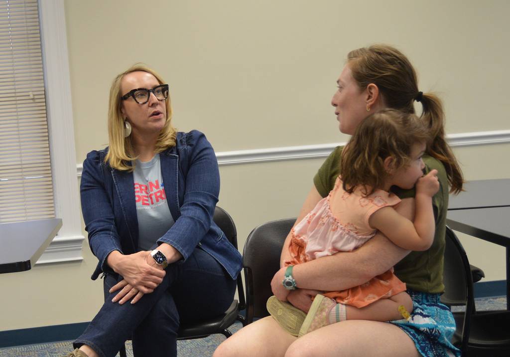 Erin Petrey, left, a Democratic candidate for the 6th District in Congress, talks with Robin Kunkel