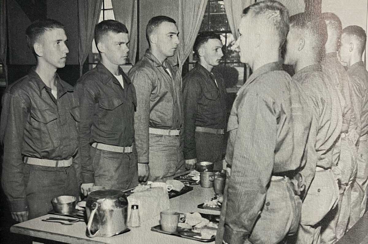Once eight of the Marine recruits had moved along the serving line and gone to a table, they were to stand at attention until all eight had arrived, at which time one member would utter “Seats” and they would all sit simultaneously.
